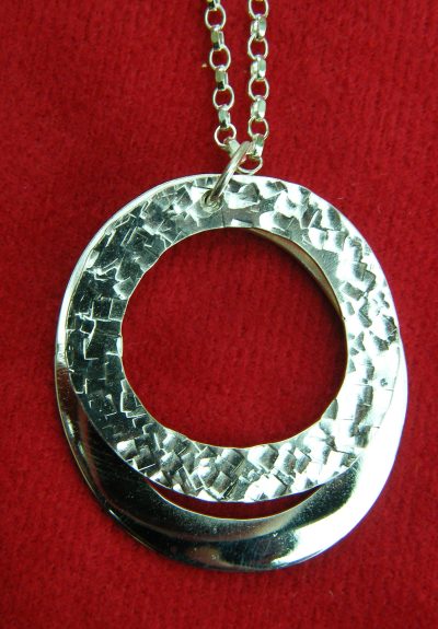 Twin rings pendant with lower ring bright polished
